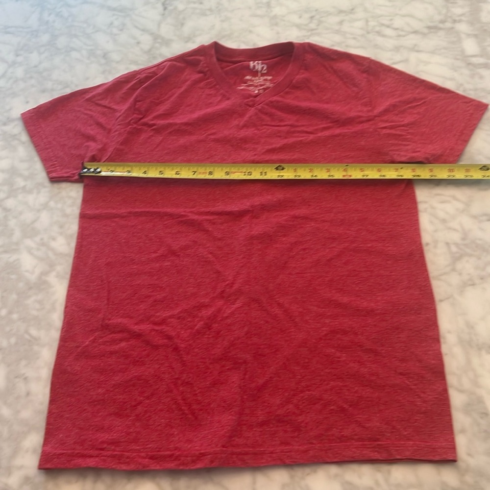 Like new red V-neck slim fit 50/50cotton polyester size large more like a medium